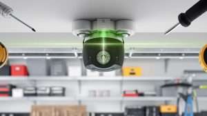 Technician aligning garage door safety sensors on the track in a Las Vegas garage