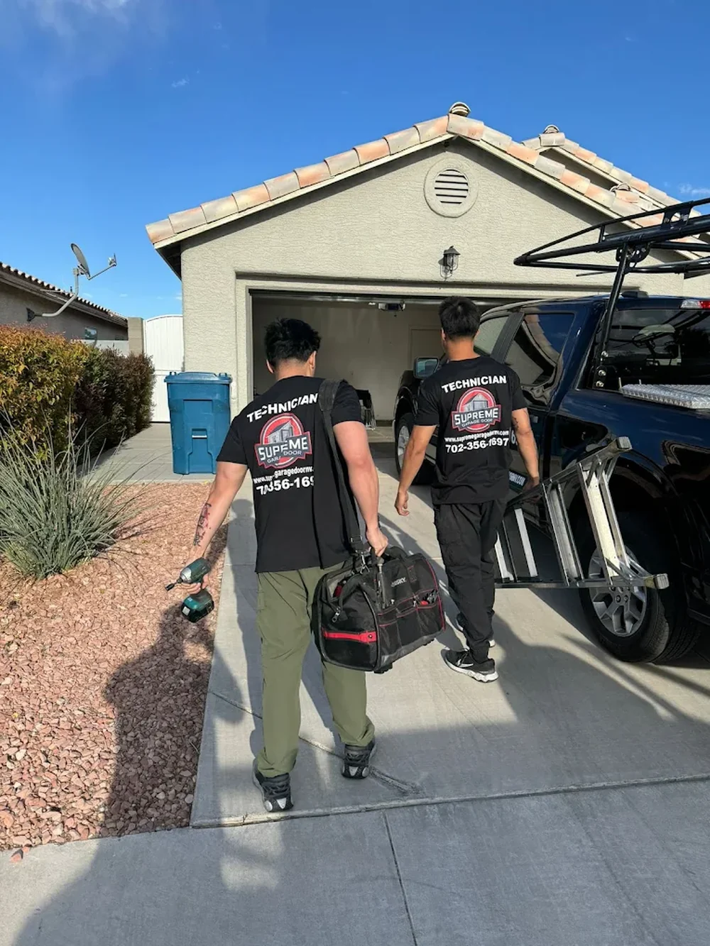 Supreme Garage Doors technicians arriving at a Las Vegas home